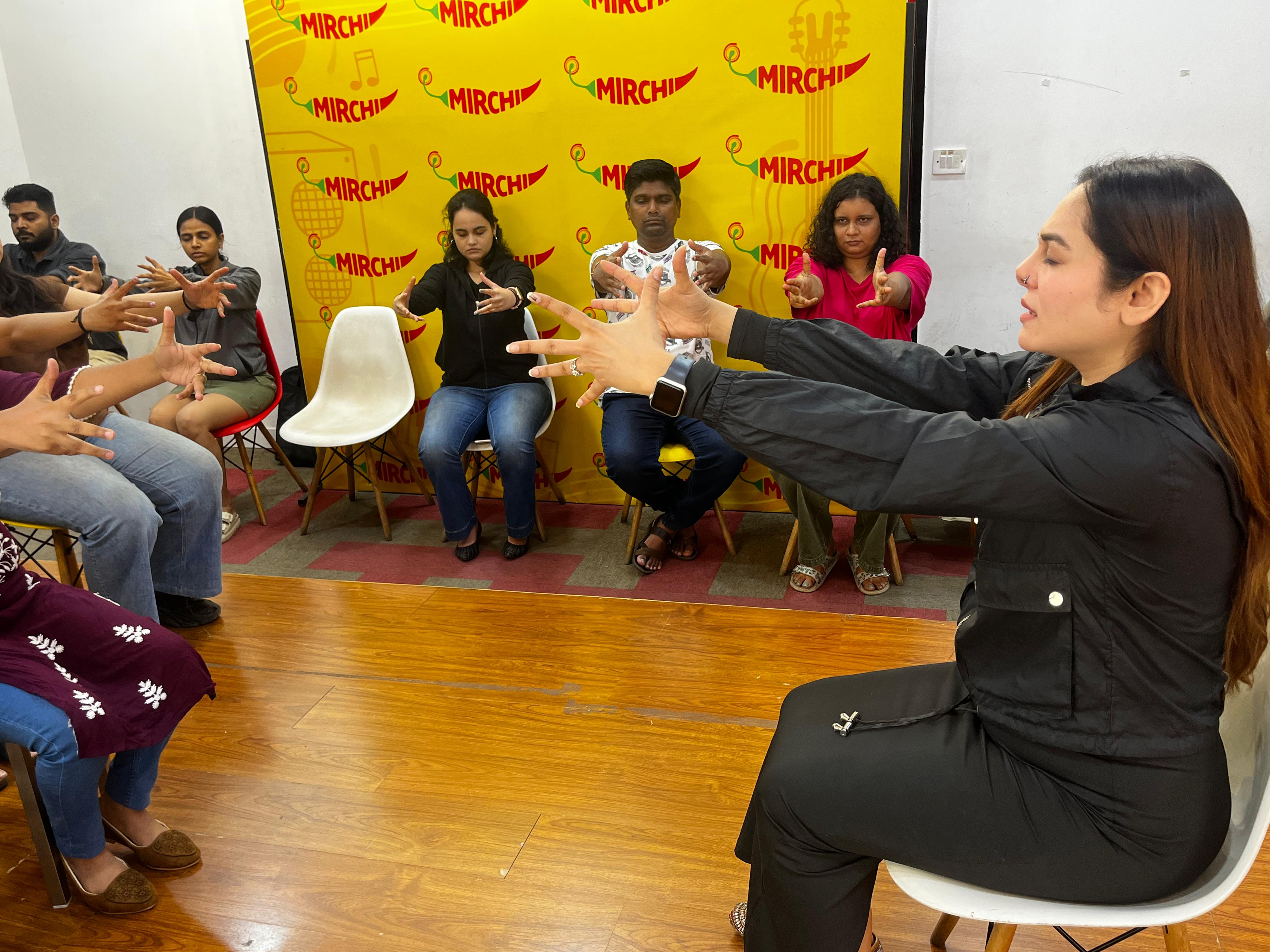 Vibha Jain leading a group hypnotherapy session for smoking cessation